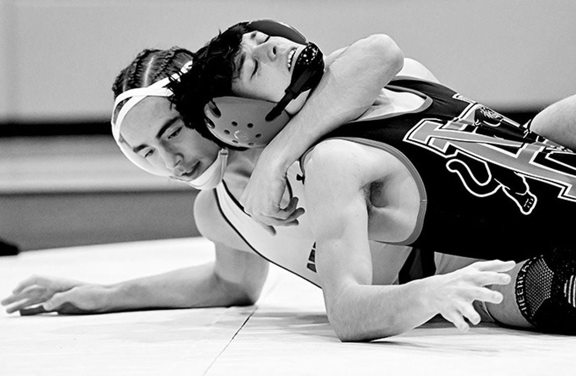 Dogs, Junior Dogs Win District Dual Wrestling